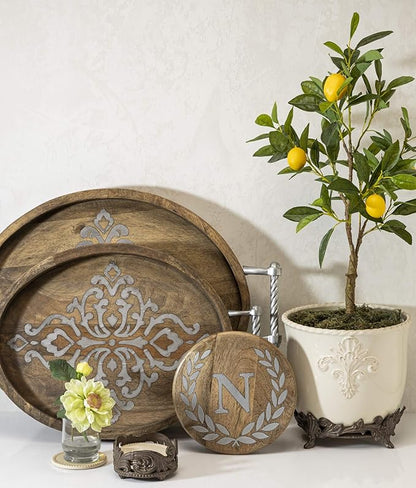 Cream Stoneware Planter on Metal Acanthus Leaf Base.